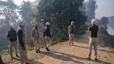 Punjab Police personnel after the encounter in which gangster Amritpal Singh was killed when he opened fire and tried to flee along Dhararh canal near Jandiala Guru in Amritsar district on Wednesday. (HT Photo)