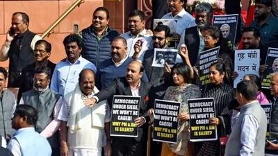 Suspended MPs stage a protest at Makar Dwar (ANI Photo) Suspended MPs stage a protest at Makar Dwar (ANI Photo)