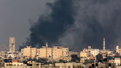 A picture taken from Rafah shows smoke billowing over Khan Yunis in the southern Gaza Strip during Israeli bombardment (AFP)