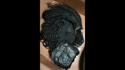 The accused had allegedly concealed the cocaine in her hair wig and bra pads, the sources said The accused had allegedly concealed the cocaine in her hair wig and bra pads, the sources said