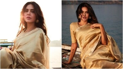 Esha Gupta travelled to Banaras recently to do a photoshoot by the ghats. The pictures are a vision to behold and show the actor posing on a boat while dressed in a stunning saree. She hopped on the gold silk saree trend for the pictures and nailed it elegantly. Scroll through to check out the shoot. (Instagram) Esha Gupta travelled to Banaras recently to do a photoshoot by the ghats. The pictures are a vision to behold and show the actor posing on a boat while dressed in a stunning saree. She hopped on the gold silk saree trend for the pictures and nailed it elegantly. Scroll through to check out the shoot. (Instagram)
