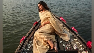 Esha's gold Kanjeevaram silk saree features broad borders with an intricately embroidered design. She wore the six yards elegantly in traditional style, letting the pallu fall from her shoulder and making the pleats in the front. She wore the drape with a matching silk blouse featuring a round neckline, quarter-length sleeves, cropped hem, and a fitted silhouette. (Instagram) Esha's gold Kanjeevaram silk saree features broad borders with an intricately embroidered design. She wore the six yards elegantly in traditional style, letting the pallu fall from her shoulder and making the pleats in the front. She wore the drape with a matching silk blouse featuring a round neckline, quarter-length sleeves, cropped hem, and a fitted silhouette. (Instagram)