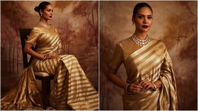 Meanwhile, Esha styled the look with a layered gold and Kundan necklace, matching bangles, rings, and dainty earrings. Lastly, she opted for winged eyeliner, glittering smoky eye shadow, mascara on the lashes, darkened brows, a red bindi, bold red lip shade, centre-parted sleek bun, rouge on the cheeks, and highlighter on the contours for the glam picks. (Instagram) Meanwhile, Esha styled the look with a layered gold and Kundan necklace, matching bangles, rings, and dainty earrings. Lastly, she opted for winged eyeliner, glittering smoky eye shadow, mascara on the lashes, darkened brows, a red bindi, bold red lip shade, centre-parted sleek bun, rouge on the cheeks, and highlighter on the contours for the glam picks. (Instagram)