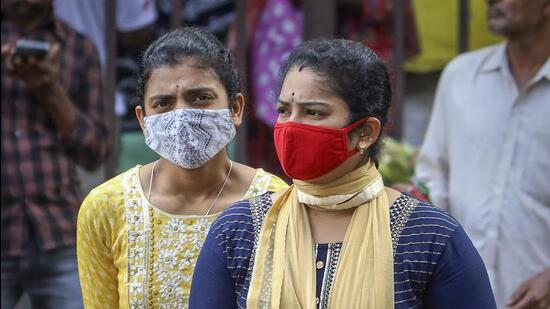 People wearing face masks as a precautionary measure after cases of COVID-19 sub-variant JN.1 were detected in the country in Bengaluru on Wednesday (PTI)