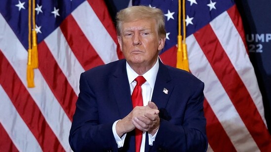 Donald Trump gestures at the end of a campaign event in Waterloo, Iowa, on December 19, 2023 (Photo by KAMIL KRZACZYNSKI / AFP) (AFP)