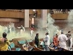 Two men entered the Lok Sabha on December 13 and sprayed yellow smoke in a major security breach. Two men entered the Lok Sabha on December 13 and sprayed yellow smoke in a major security breach.
