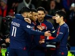 Paris St Germain's Kylian Mbappe celebrates with teammates after scoring their third goal 