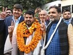 Former Wrestling Federation of India (WFI) chief Brij Bhushan Sharan Singh with newly appointed WFI chief Sanjay Singh. (ANI)