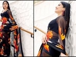 Rashmika Mandanna can't get enough of her black floral printed saree. It costs.. Rashmika Mandanna can't get enough of her black floral printed saree. It costs..