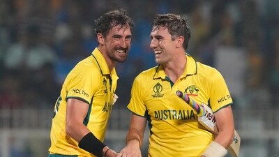 Australia's captain Pat Cummins (R) and Mitchell Starc celebrate (AP) Australia's captain Pat Cummins (R) and Mitchell Starc celebrate (AP)