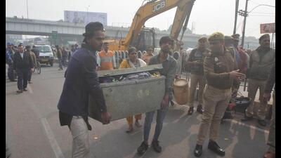 LDA bulldozers reached Akbarnagar on the banks of river Kukrail in Lucknow to demolish around 1,200 illegal structures. (HT Photo)
