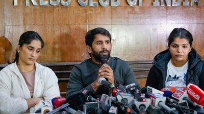 Wrestlers Vinesh Phogat, Bajrang Punia and Sakshi Malik address a press conference after Sanjay Singh, an associate of BJP MP and former chief of Wrestling Federation of India (WFI) Brij Bhushan Sharan Singh, became the new President of WFI. (PTI) Wrestlers Vinesh Phogat, Bajrang Punia and Sakshi Malik address a press conference after Sanjay Singh, an associate of BJP MP and former chief of Wrestling Federation of India (WFI) Brij Bhushan Sharan Singh, became the new President of WFI. (PTI)