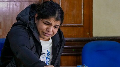 Wrestler Sakshi Malik during a press conference after Sanjay Singh, an associate of BJP MP and former chief of Wrestling Federation of India (WFI) Brij Bhushan Sharan Singh, became the new President of WFI, in New Delhi, Thursday, Dec. 21, 2023. (PTI) Wrestler Sakshi Malik during a press conference after Sanjay Singh, an associate of BJP MP and former chief of Wrestling Federation of India (WFI) Brij Bhushan Sharan Singh, became the new President of WFI, in New Delhi, Thursday, Dec. 21, 2023. (PTI)