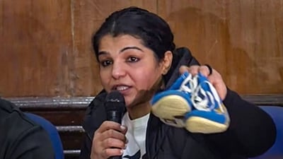 Wrestler Sakshi Malik hangs up her boots during a press conference as she announces her retirement from the sport (PTI) Wrestler Sakshi Malik hangs up her boots during a press conference as she announces her retirement from the sport (PTI)