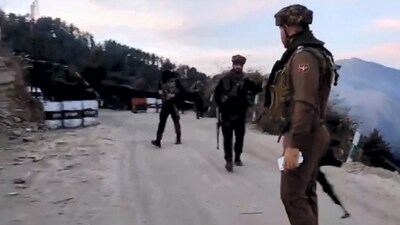 Poonch: Army personnel stand guard near the site where an Army vehicle was ambushed by terrorists. (PTI) Poonch: Army personnel stand guard near the site where an Army vehicle was ambushed by terrorists. (PTI)