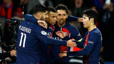 Paris St Germain's Kylian Mbappe celebrates with teammates after scoring their third goal (REUTERS)