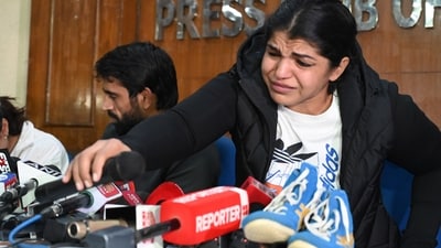 Wrestlers Vinesh Phogat, Bajrang Punia and Sakshi Malik during a press conference at Press Club of India , in New Delhi, India, on Thursday, December 21, 2023.  (Photo by Vipin Kumar/ Hindustan Times)
