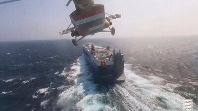 This photo released by the Houthi Media Center shows a Houthi forces helicopter approaching the cargo ship Galaxy Leader on Sunday, Nov. 19, 2023. Yemen's Houthis have seized the ship in the Red Sea off the coast of Yemen after threatening to seize all vessels owned by Israeli companies. (Houthi Media Center via AP) (AP) This photo released by the Houthi Media Center shows a Houthi forces helicopter approaching the cargo ship Galaxy Leader on Sunday, Nov. 19, 2023. Yemen's Houthis have seized the ship in the Red Sea off the coast of Yemen after threatening to seize all vessels owned by Israeli companies. (Houthi Media Center via AP) (AP)