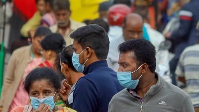 People wearing face masks as a precautionary measure after cases of COVID-19 sub-variant JN.1 were detected in the country. (PTI) People wearing face masks as a precautionary measure after cases of COVID-19 sub-variant JN.1 were detected in the country. (PTI)