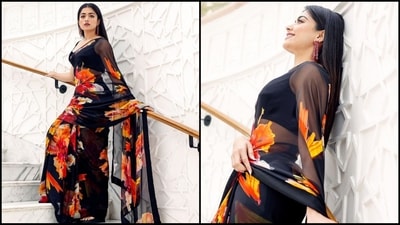 Rashmika Mandanna can't get enough of her black floral printed saree. It costs.. (Instagram/@rashmika_mandanna) Rashmika Mandanna can't get enough of her black floral printed saree. It costs.. (Instagram/@rashmika_mandanna)
