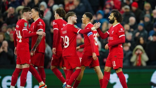 Liverpool's Mohamed Salah, right, is congratulated after scoring his side's 4th goal during the English League Cup quarterfinal (AP)