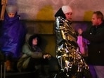 People wait near the building of Philosophical Faculty of Charles University in downtown Prague, Czech Republic, on December 21. People wait near the building of Philosophical Faculty of Charles University in downtown Prague, Czech Republic, on December 21.