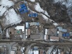 China Earthquake: An aerial view shows emergency tents and damaged houses standing amid snow-covered grounds at Yangwa village.