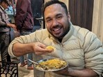 Chef Saransh Goila enjoying biryani during his visit to Lucknow