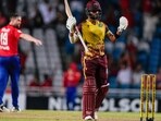 West Indies' Shai Hope celebrates hitting a six from a delivery of England's Chris Woakes to win by 4 wickets the fifth T20 cricket match at Brian Lara Stadium West Indies' Shai Hope celebrates hitting a six from a delivery of England's Chris Woakes to win by 4 wickets the fifth T20 cricket match at Brian Lara Stadium