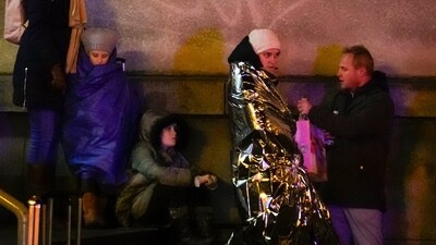 People wait near the building of Philosophical Faculty of Charles University in downtown Prague, Czech Republic, on December 21. (AP) People wait near the building of Philosophical Faculty of Charles University in downtown Prague, Czech Republic, on December 21. (AP)