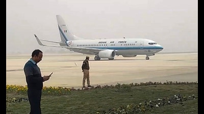 An aircraft lands during a trial run of flights at the Ayodhya International Airport ahead of its inauguration, in Ayodhya on Friday. (PTI)