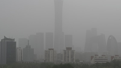 High rise buildings at central business district are seen on a severely polluted day in Beijing on April 12, 2023. (AFP)