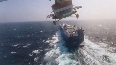 Houthi military helicopter flies over the Galaxy Leader cargo ship in the Red Sea in this photo released November 20, 2023. (via REUTERS/File)