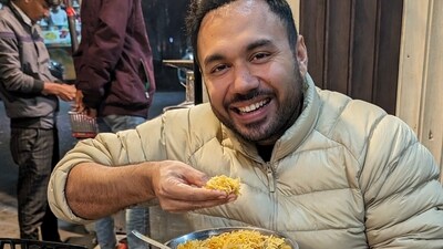 Chef Saransh Goila enjoying biryani during his visit to Lucknow