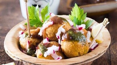 Ram Laddoo: This is a classic, popular street food from Delhi made with a batter of dals and spices. It is a perfect winter street food that is served over some grated radish & special green chutney. (Pinterest) Ram Laddoo: This is a classic, popular street food from Delhi made with a batter of dals and spices. It is a perfect winter street food that is served over some grated radish & special green chutney. (Pinterest)