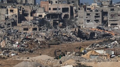 Israel-Hamas War: An Israeli army tank rolling past debris of buildings in the Gaza Strip. (AFP) Israel-Hamas War: An Israeli army tank rolling past debris of buildings in the Gaza Strip. (AFP)