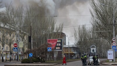 Smoke rises over buildings in an aftermath of recent shelling in Donetsk, (AFP)