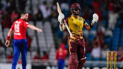 West Indies' Shai Hope celebrates hitting a six from a delivery of England's Chris Woakes to win by 4 wickets the fifth T20 cricket match at Brian Lara Stadium (AP) West Indies' Shai Hope celebrates hitting a six from a delivery of England's Chris Woakes to win by 4 wickets the fifth T20 cricket match at Brian Lara Stadium (AP)