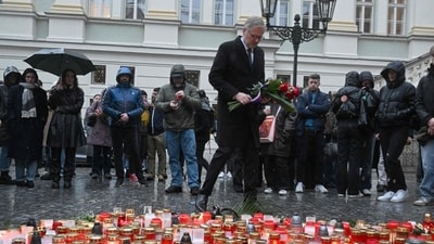 Czech Prime Minister Petr Fiala lays flowers at an impromptu memorial outside Charles University in central Prague. The government announced a day of national mourning, with flags to be flown at half-mast and a minute's silence to be observed at noon on December 23. (AFP) Czech Prime Minister Petr Fiala lays flowers at an impromptu memorial outside Charles University in central Prague. The government announced a day of national mourning, with flags to be flown at half-mast and a minute's silence to be observed at noon on December 23. (AFP)