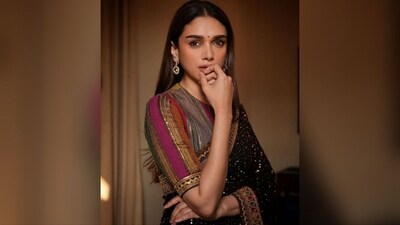 Aditi left her long, straight locks open at the centre part to cascade beautifully down her shoulders, perfectly complementing her regal look. A small black bindi adorning her forehead added the finishing touch. (Instagram/@aditiraohydari) Aditi left her long, straight locks open at the centre part to cascade beautifully down her shoulders, perfectly complementing her regal look. A small black bindi adorning her forehead added the finishing touch. (Instagram/@aditiraohydari)
