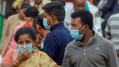 People wearing face masks as a precautionary measure after cases of COVID-19 sub-variant JN.1 were detected in the country. (PTI) People wearing face masks as a precautionary measure after cases of COVID-19 sub-variant JN.1 were detected in the country. (PTI)