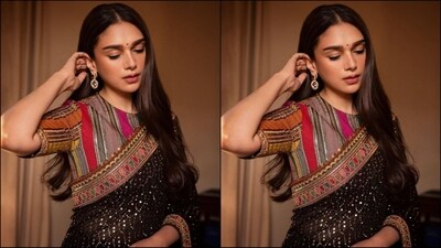 In terms of accessories, Aditi kept things minimal to let her outfit shine, and styled her look with just a pair of emerald gold statement earrings and matching high heels. (Instagram/@aditiraohydari) In terms of accessories, Aditi kept things minimal to let her outfit shine, and styled her look with just a pair of emerald gold statement earrings and matching high heels. (Instagram/@aditiraohydari)