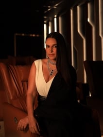 Neha Dhupia stuns in a monochrome dress from Shantnu & Nikhil. The look has been styled with a chic diamond choker along with strands studded with fine quality diamonds and Zambian emeralds from Naulakha Jewellers
