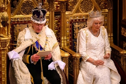Britain's King Charles III delivers a speech beside Queen Camilla during the State Opening of Parliament in the House of Lords Chamber, in London, on November 7. (Reuters)