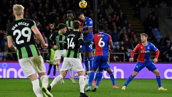 Brighton's English striker #18 Danny Welbeck (centre L) headers the ball to score the equalising goal during the English Premier League football match between Crystal Palace and Brighton (AFP)