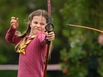 Britain's Princess Charlotte tries her hand at archery.