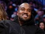 FILE - Kanye West, known as Ye, watches the first half of an NBA basketball game between the Washington Wizards and the Los Angeles Lakers in Los Angeles, March 11, 2022. Adidas saw operating earnings dwindle in the first three months of the year as the German sportswear company's breakup with the rapper formerly known as Kanye West and his popular Yeezy shoe brand cost it 400 million euros ($441 million) in lost sales. Profit was down to 60 million euros from 437 million euros in the same quarter a year ago, while profit margin shrank to a bare 1.1%. Net sales declined 1%, to 5.27 billion euros, and would have risen 9% with the Yeezy line, the company said Friday, May 5, 2023. (AP Photo/Ashley Landis, File) FILE - Kanye West, known as Ye, watches the first half of an NBA basketball game between the Washington Wizards and the Los Angeles Lakers in Los Angeles, March 11, 2022. Adidas saw operating earnings dwindle in the first three months of the year as the German sportswear company's breakup with the rapper formerly known as Kanye West and his popular Yeezy shoe brand cost it 400 million euros ($441 million) in lost sales. Profit was down to 60 million euros from 437 million euros in the same quarter a year ago, while profit margin shrank to a bare 1.1%. Net sales declined 1%, to 5.27 billion euros, and would have risen 9% with the Yeezy line, the company said Friday, May 5, 2023. (AP Photo/Ashley Landis, File)
