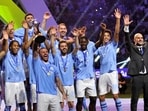 Manchester City's Kyle Walker lifts the trophy alongside teammates after winning the Club World Cup final 