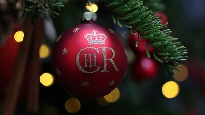 Christmas decorations, including a bauble featuring the cypher of King Charles III, are pictured on the Downing Street Christmas tree in central London. (AFP) Christmas decorations, including a bauble featuring the cypher of King Charles III, are pictured on the Downing Street Christmas tree in central London. (AFP)