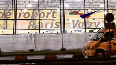 A civil protection vehicle parked outside the Vatry airport, north-eastern France where an Airbus A340 plane carrying 303 Indian passengers, is grounded on the tarmac since December 21, due to "suspicions of human trafficking", (AFP) A civil protection vehicle parked outside the Vatry airport, north-eastern France where an Airbus A340 plane carrying 303 Indian passengers, is grounded on the tarmac since December 21, due to "suspicions of human trafficking", (AFP)